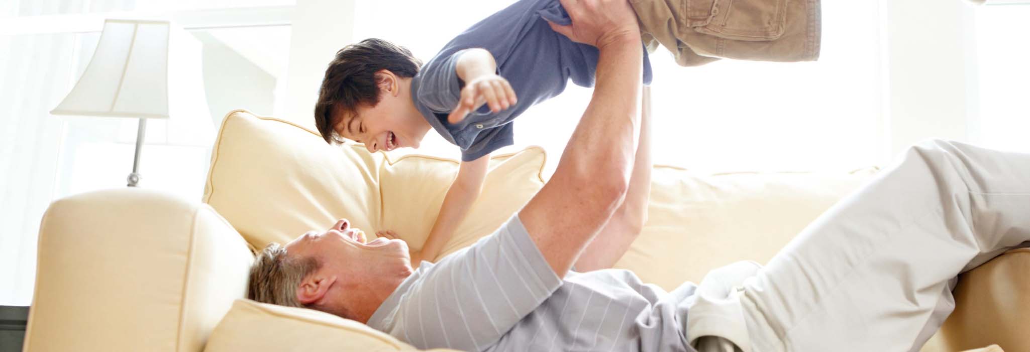 dad and kid on couch