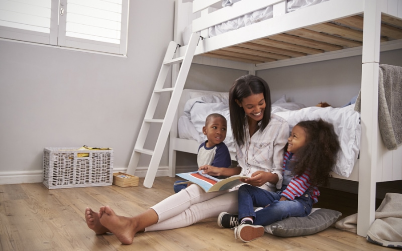 A family in La Porte, reading a book in the fresh, clean air of their home.