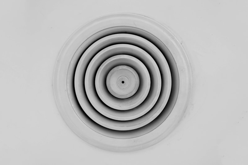 air ventilator with circle metal frame on white ceiling, leaky ducts and you