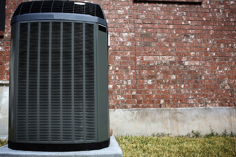 Heat pump outside of home, Transitioning Your Heat Pump | HVAC, Maintenance | La Porte, TX